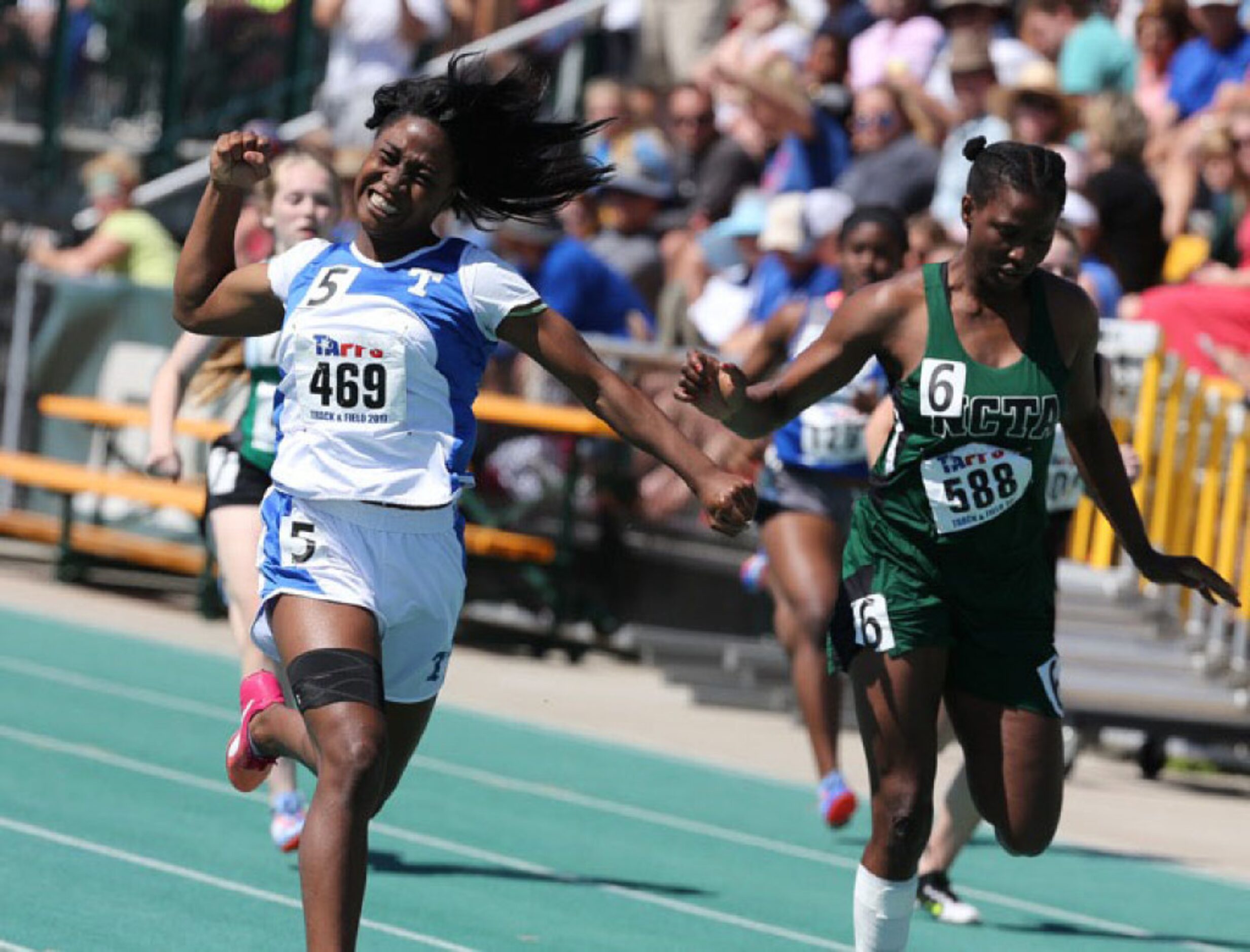 Dallas Tyler Street Christian Academy's Sadiyyah Smith, left, wins the 1A women 100 meter...