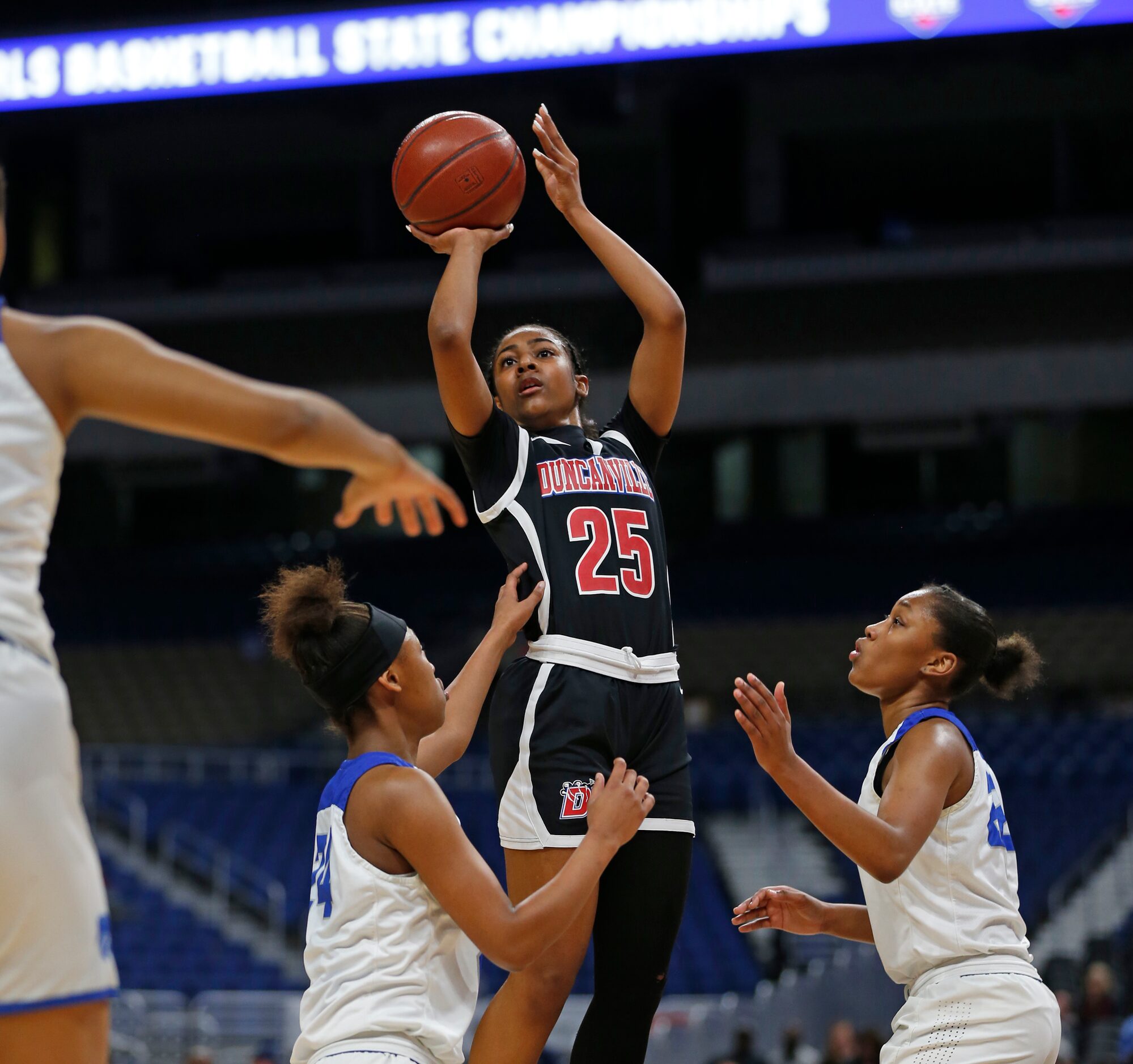 Duncanville guard Deja Kelly #25 scores two over Cypress Creek iin a 6A final on  Saturday,...