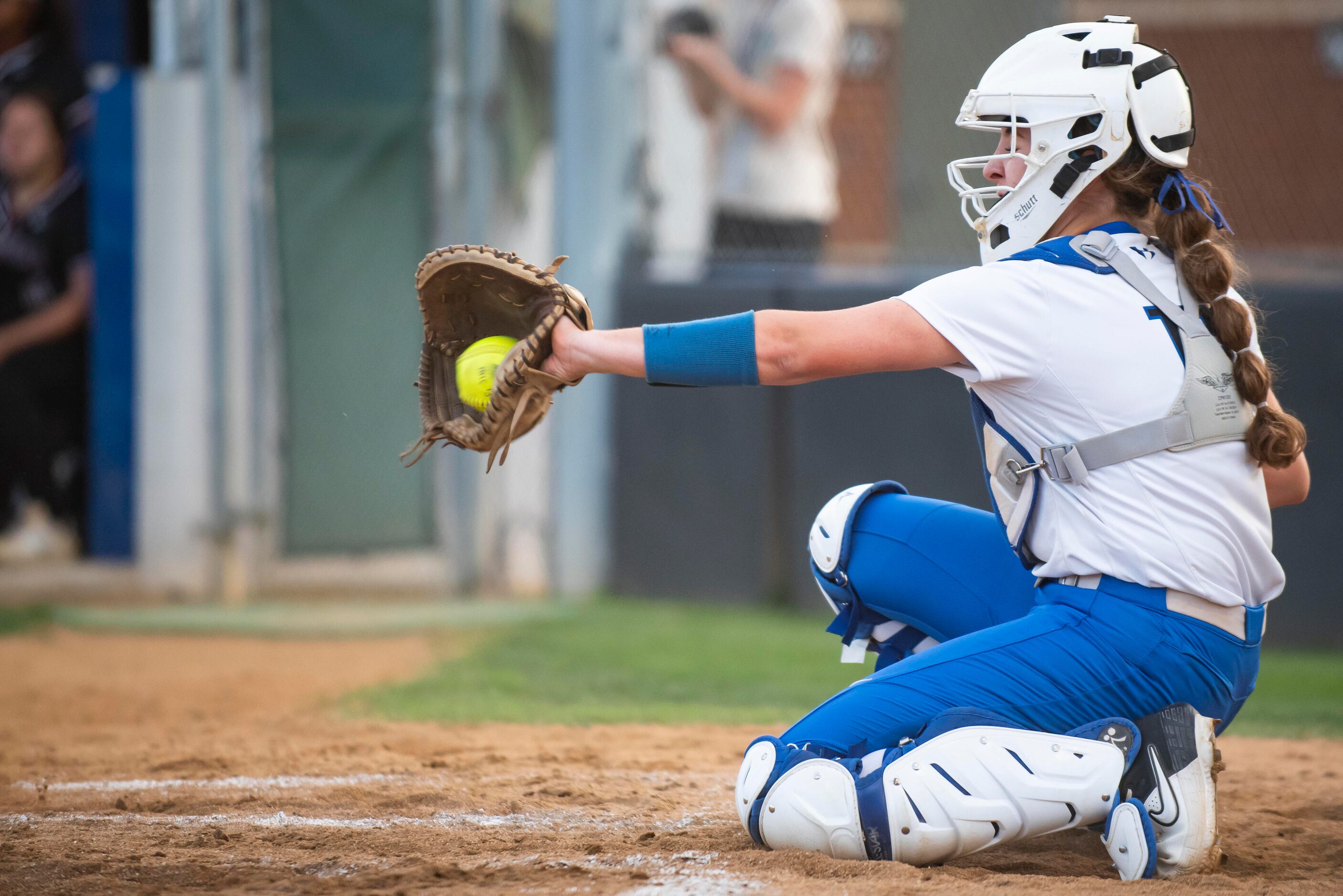 Hebron catcher Zoe Bowen (15) grabs a pitch for a strike during the District 6-6A title game...