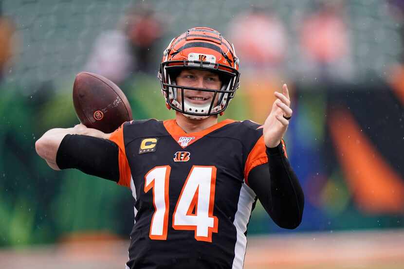 Cincinnati Bengals quarterback Andy Dalton warms up before an NFL football game against the...