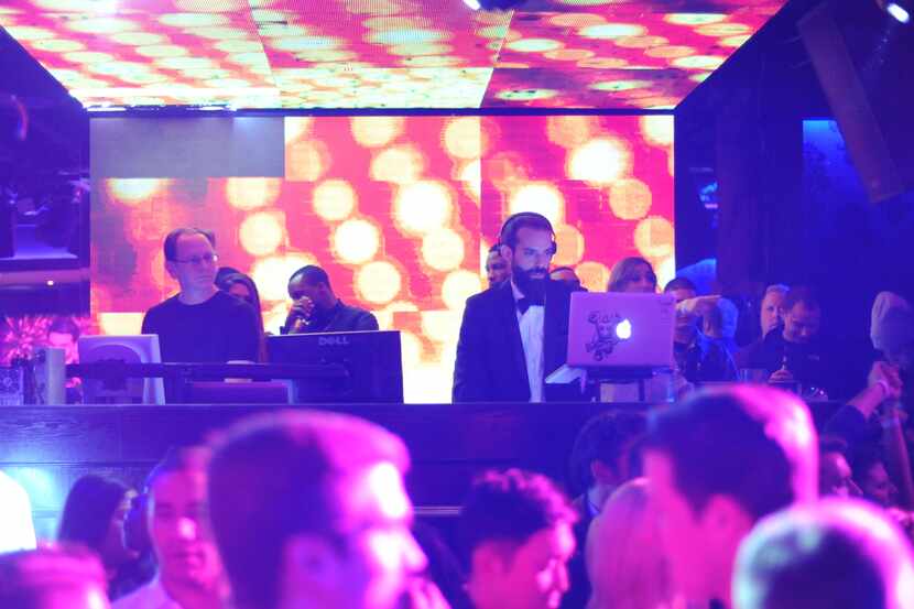 DJ S.O.U.L.Jah keeps the crowd moving on the dance floor at the new nightclub Gatsby.