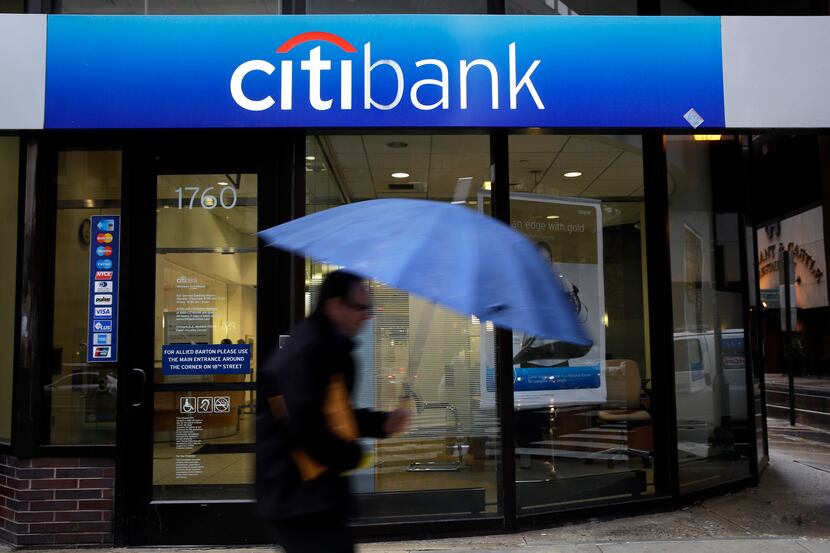 In this Jan. 14, 2014, photo,  a  person walks past a Citibank location in Philadelphia....