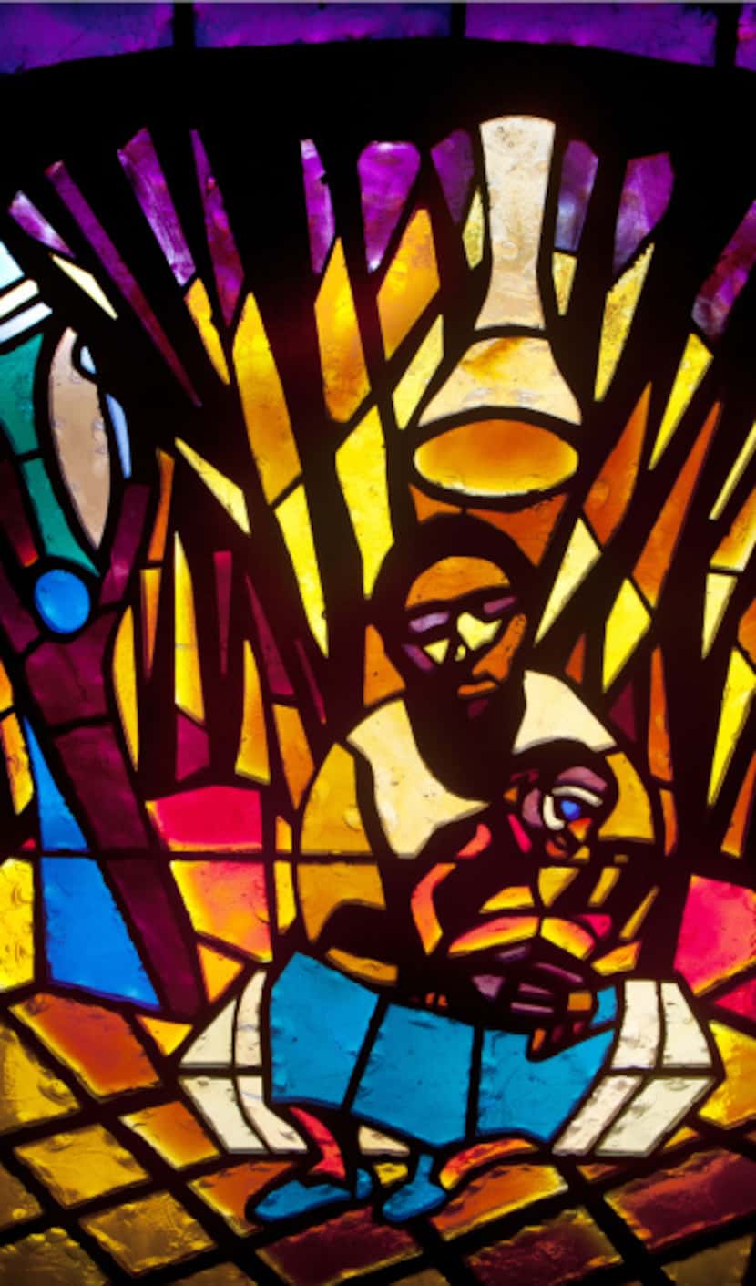 The Navity stained glass window designed by artist Jean Lacy in the Sanctuary of the St....