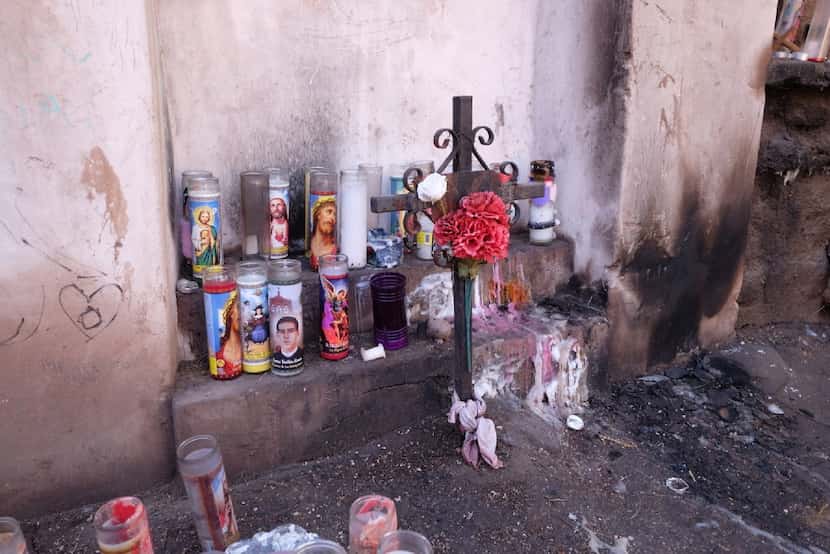 Candles are scattered around a small but fascinating shrine in downtown Tucson. 