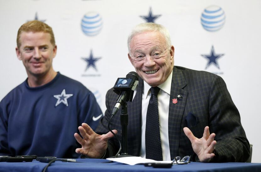 Dallas Cowboys owner Jerry Jones (right) holds court with the media after announcing a...