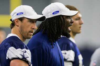 Dallas Cowboys defensive end Demarcus Lawrence (90, center) yells from the sideline between...