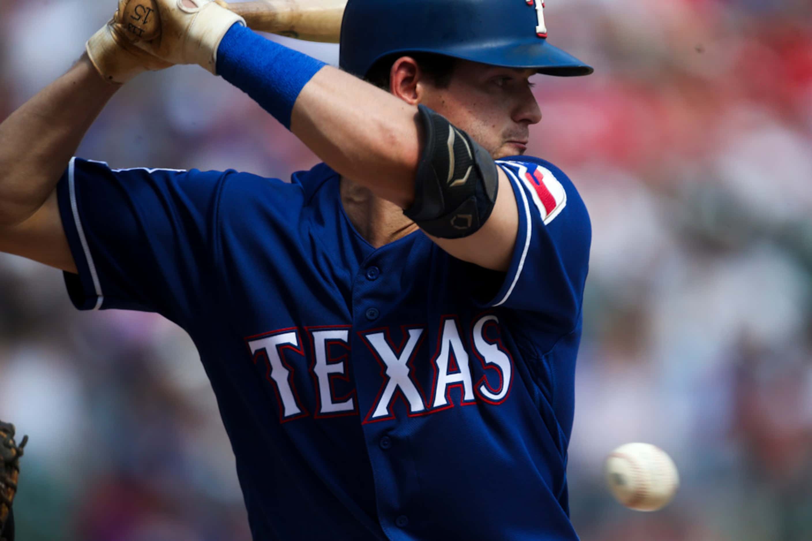 Texas Rangers second baseman Nick Solak (15) watches a pitches pass by during a MLB game...