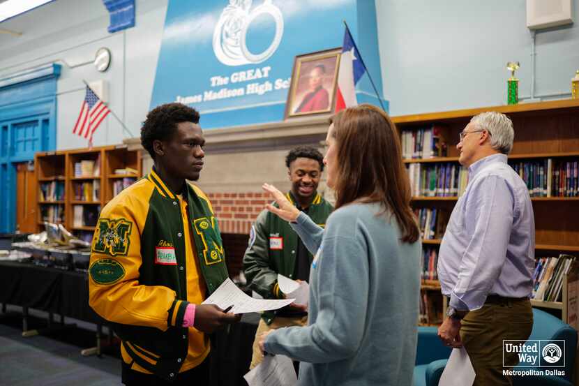 Volunteers spend time with high school students at a networking event