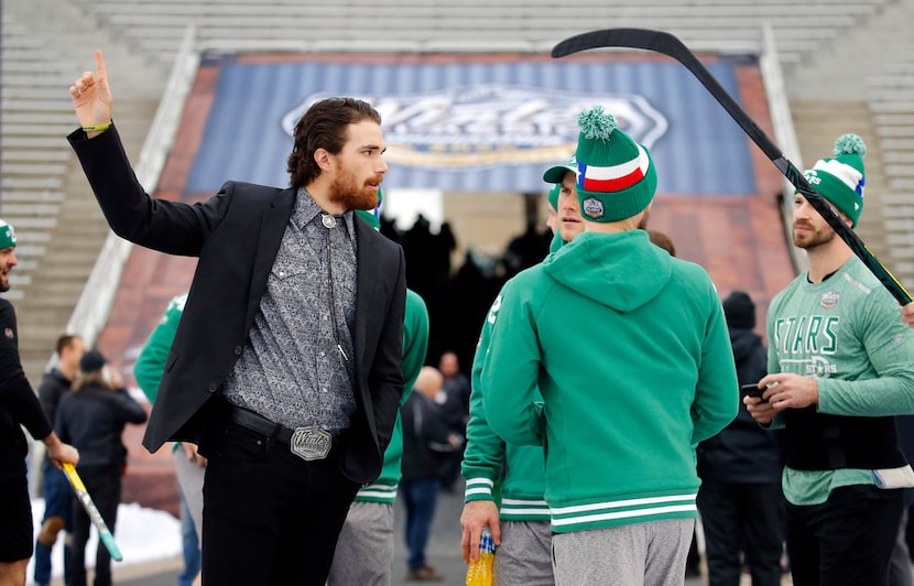 Dallas Stars injured player Stephen Johns (left) visits with his teammates as they get...