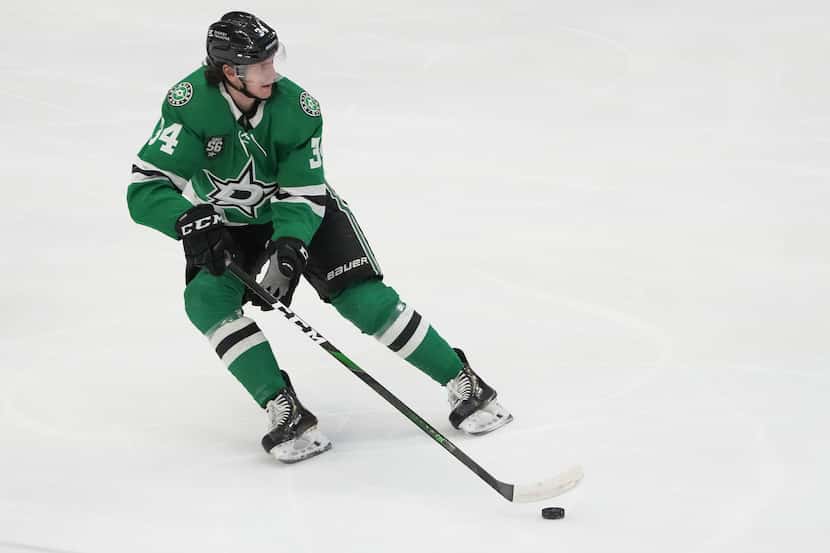 Dallas Stars right wing Denis Gurianov (34) controls the puck during the first period of an...
