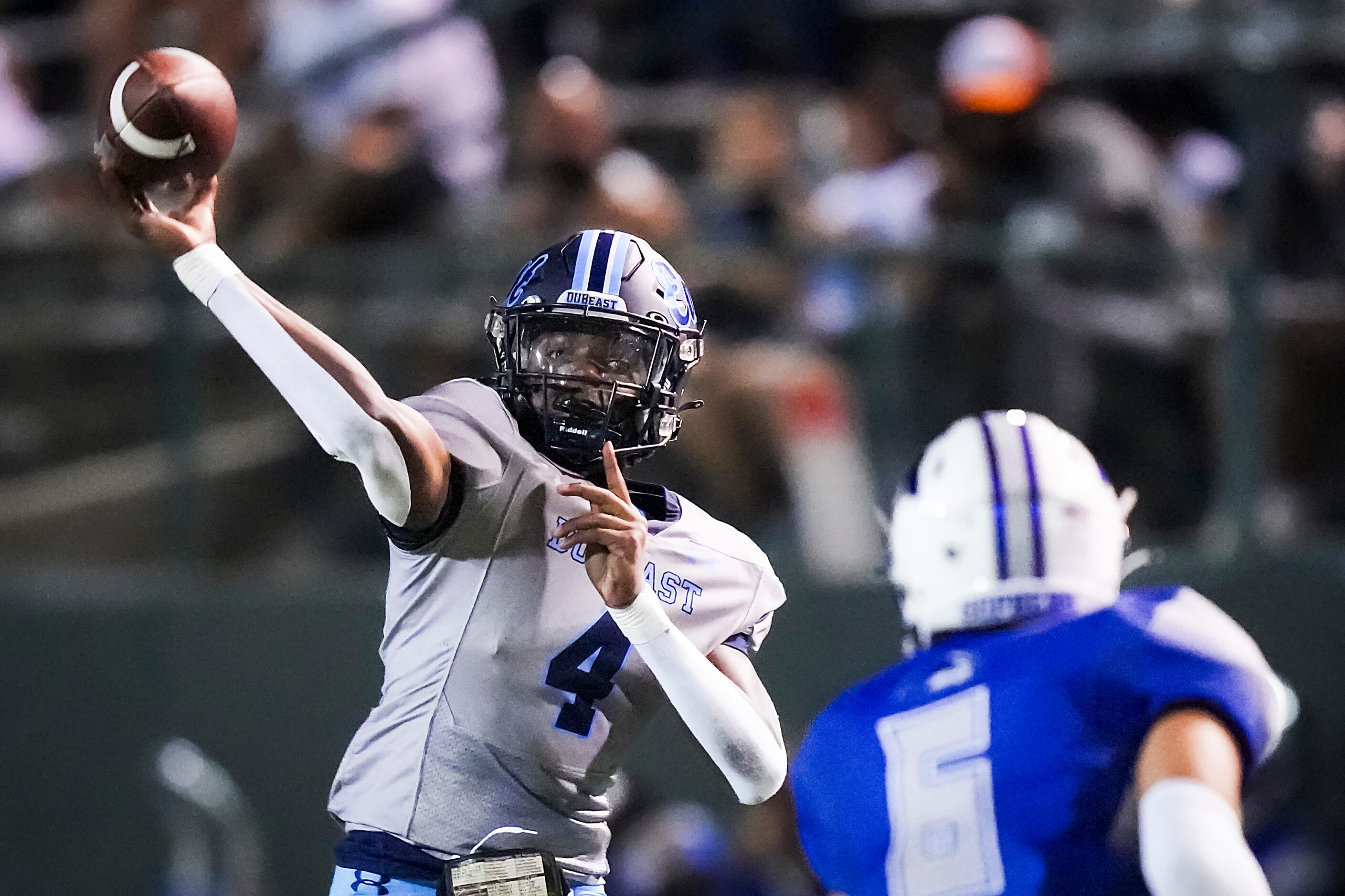 Wylie East quarterback Howard Fisher IV (4) fires a pass over Grand Prairie’s Stephan...