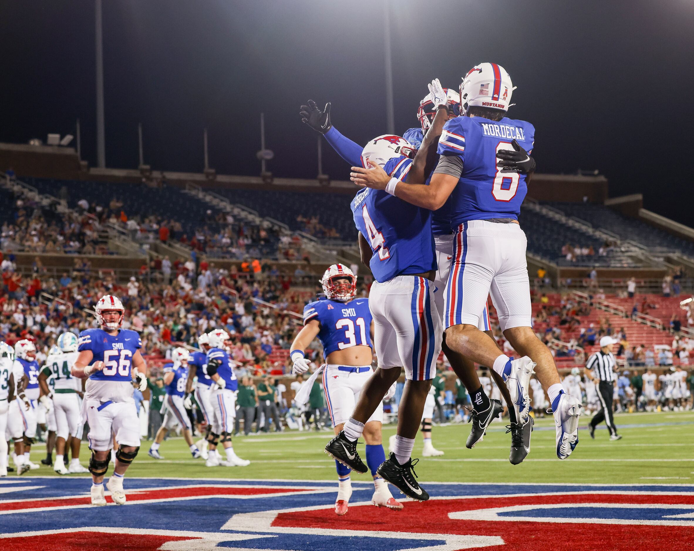 Southern Methodist Mustangs quarterback Tanner Mordecai (8) celebrates a touchdown with...