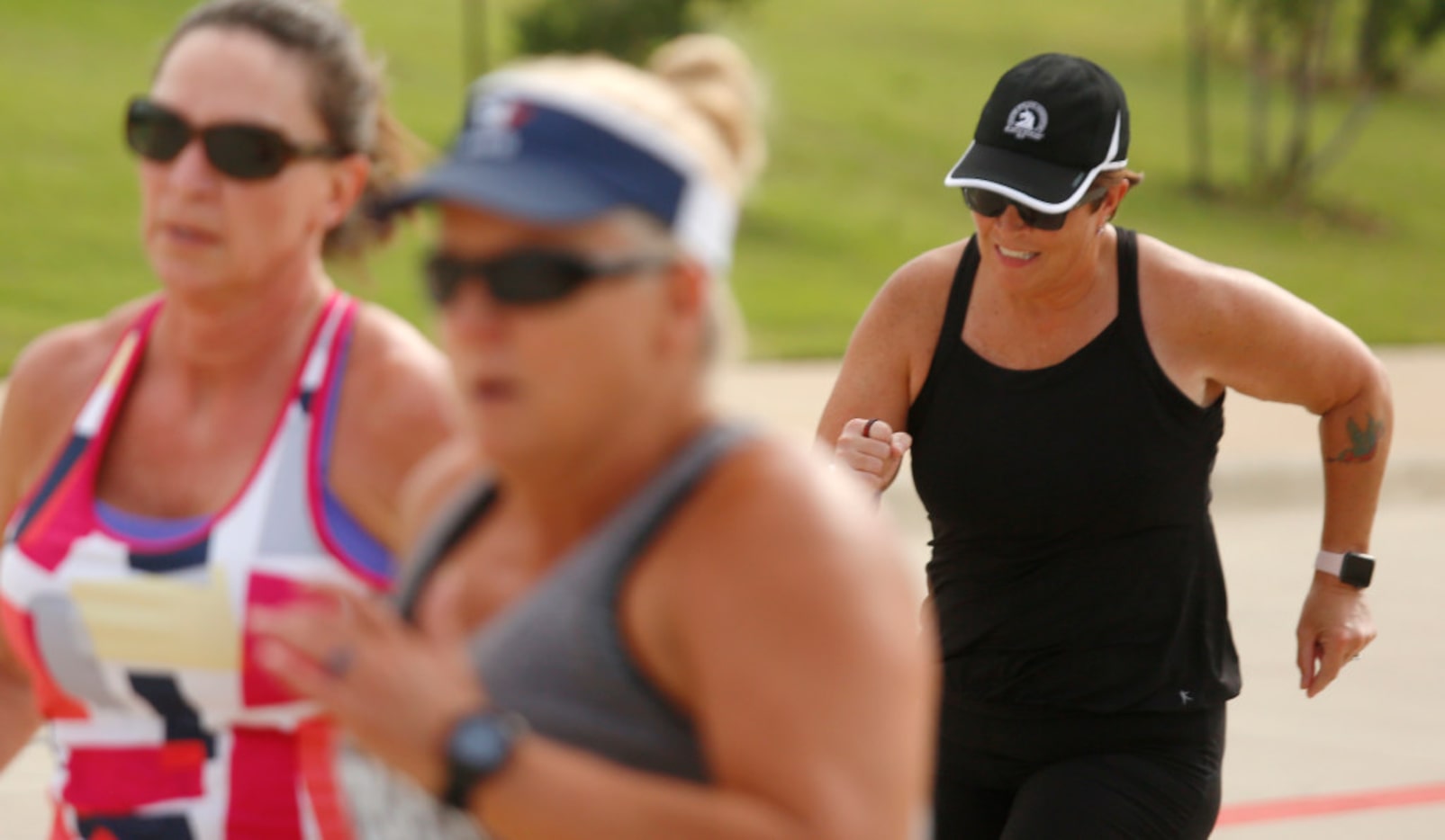 Rhonda-Lee Foulds sprints during Camp Gladiator workout held in front of Cox Elementary...