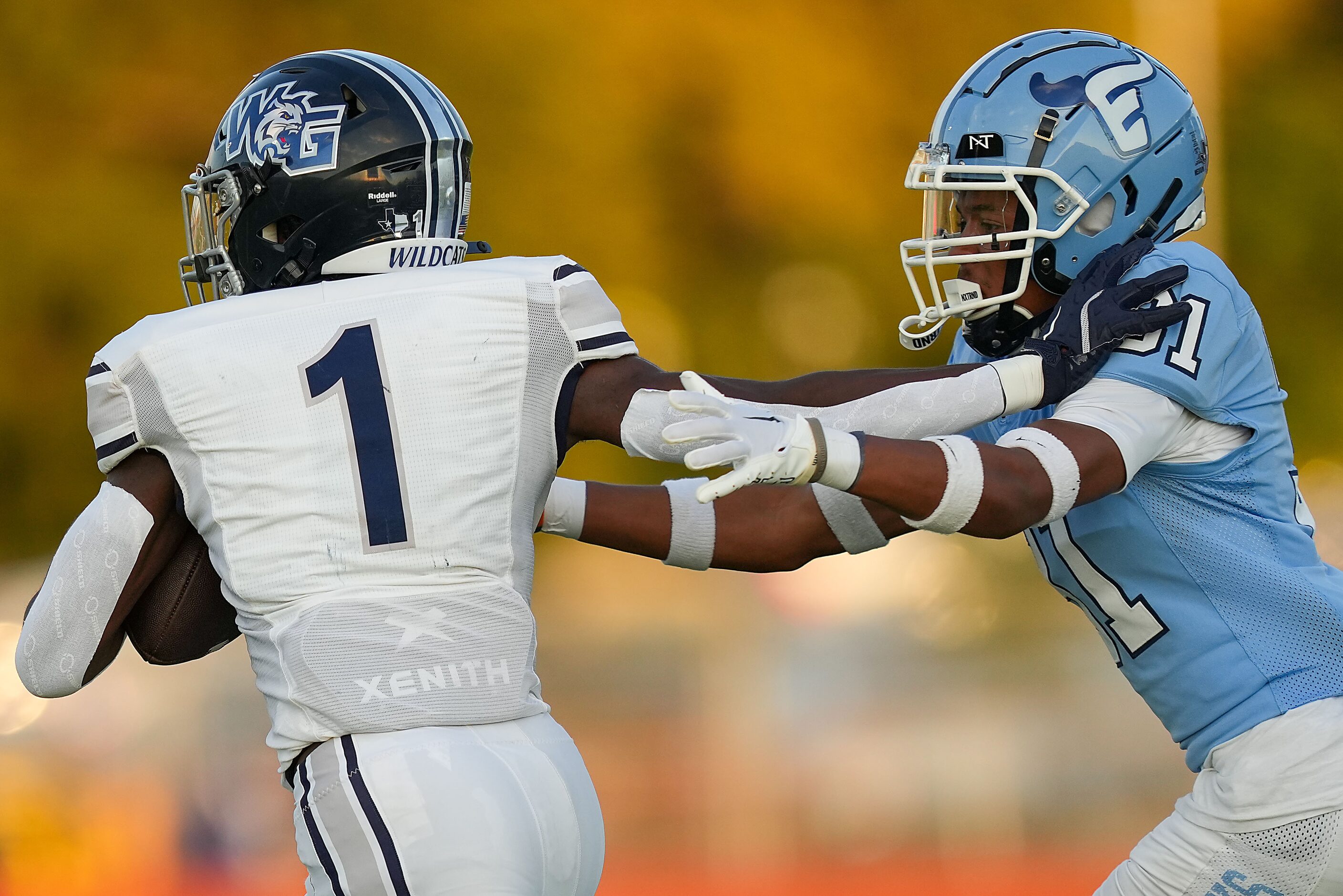 Prosper Walnut Grove running back Cam Newton (1) pushes past Frisco Emerson defensive back...