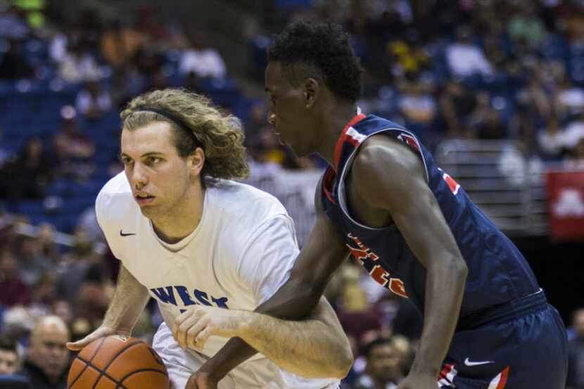 Plano West guard/forward Mickey Mitchell (00) gets past Houston Clear Lake guard Christian...