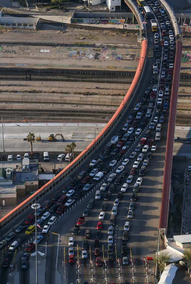 Cars wait in line to make their way into the United States through the Paso del Norte Port...