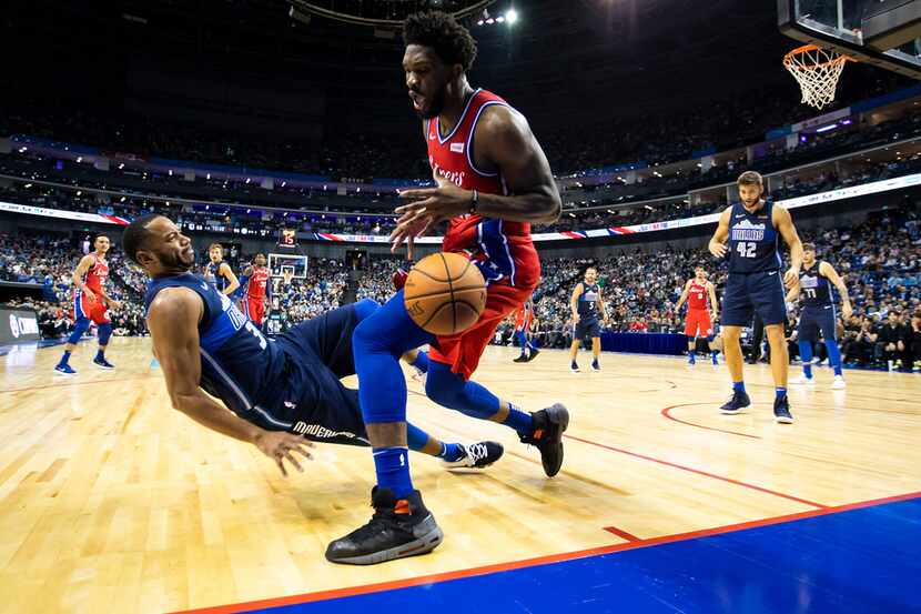 Dallas Mavericks guard Devin Harris (34) is knocked backwards in a collision with...