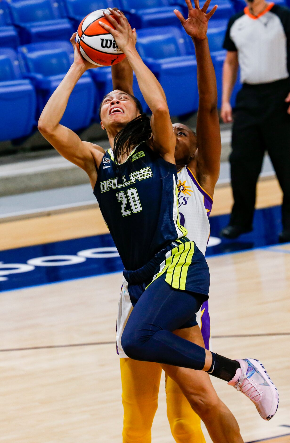 Dallas Wings forward Isabelle Harrison (20) goes for a shot in the second quarter against...