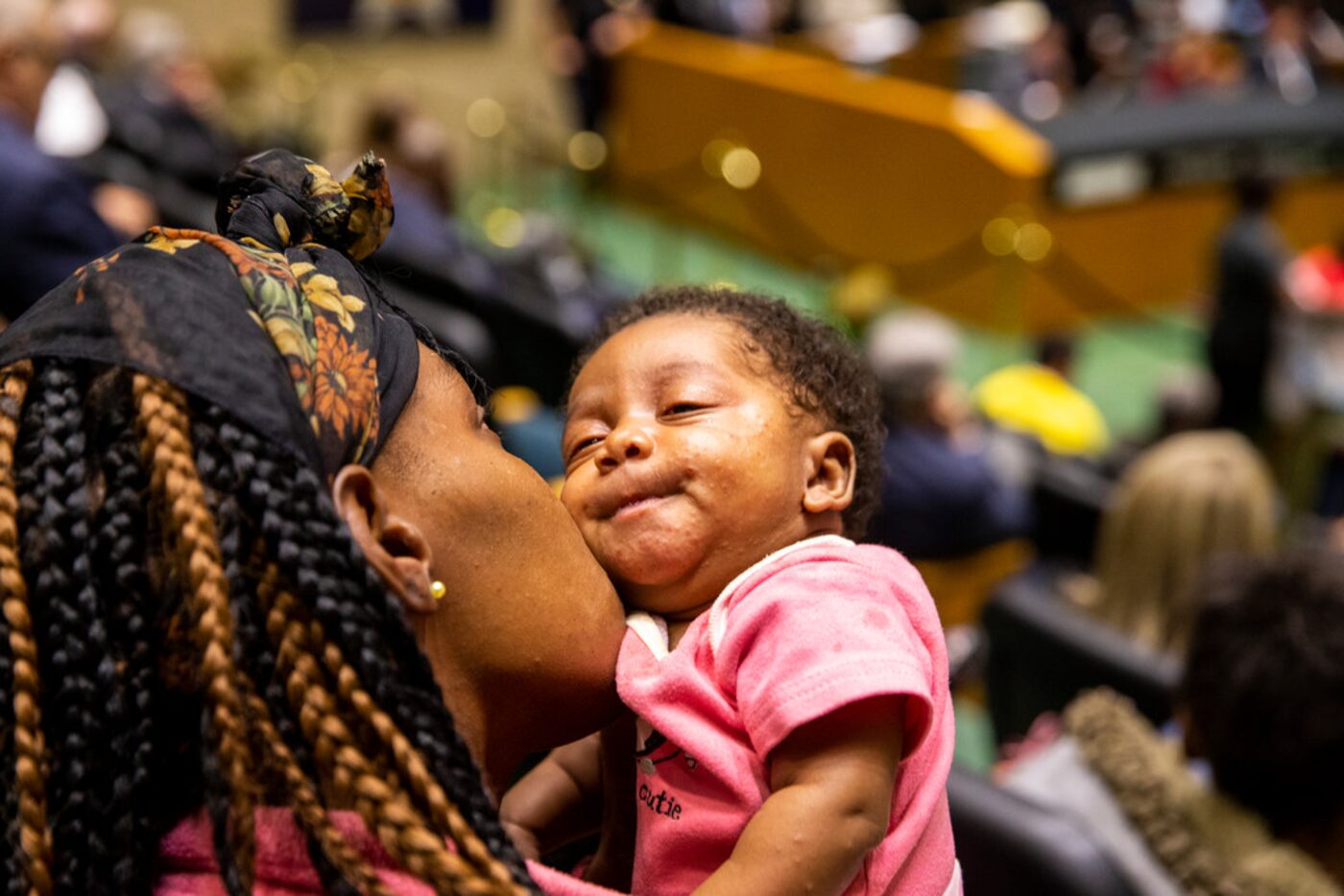 Shalay Pea, resident of Ridgecrest Terrace Apartments, kisses her 2-month-old daughter,...