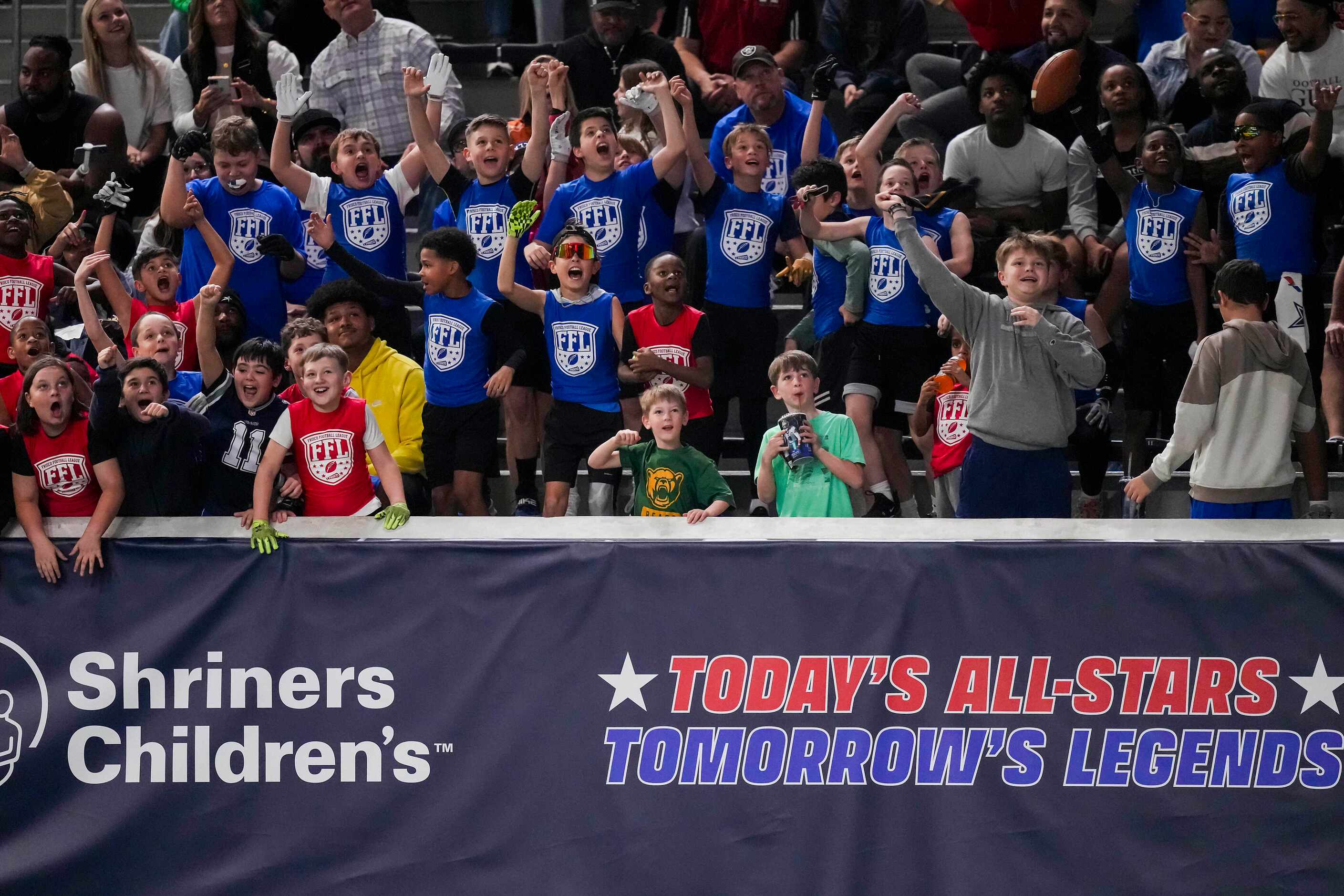 Fans cheer during the first half of the East-West Shrine Bowl all-star football game at The...