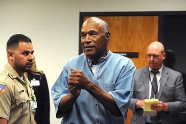 In this July 20, 2017 file photo, former NFL football star O.J. Simpson reacts after...