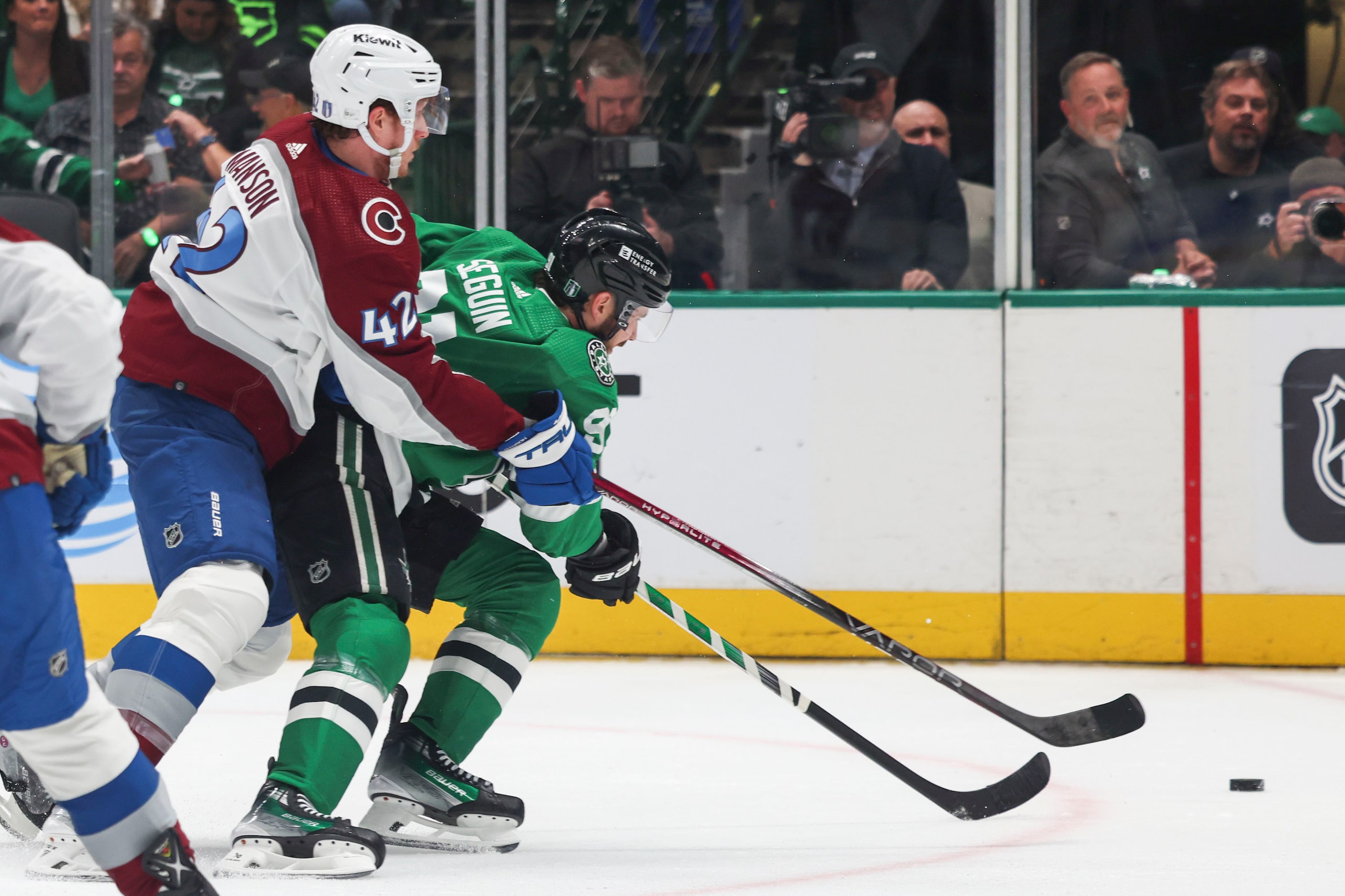 Colorado Avalanche defenseman Josh Manson (left) goes against Dallas Stars center Tyler...