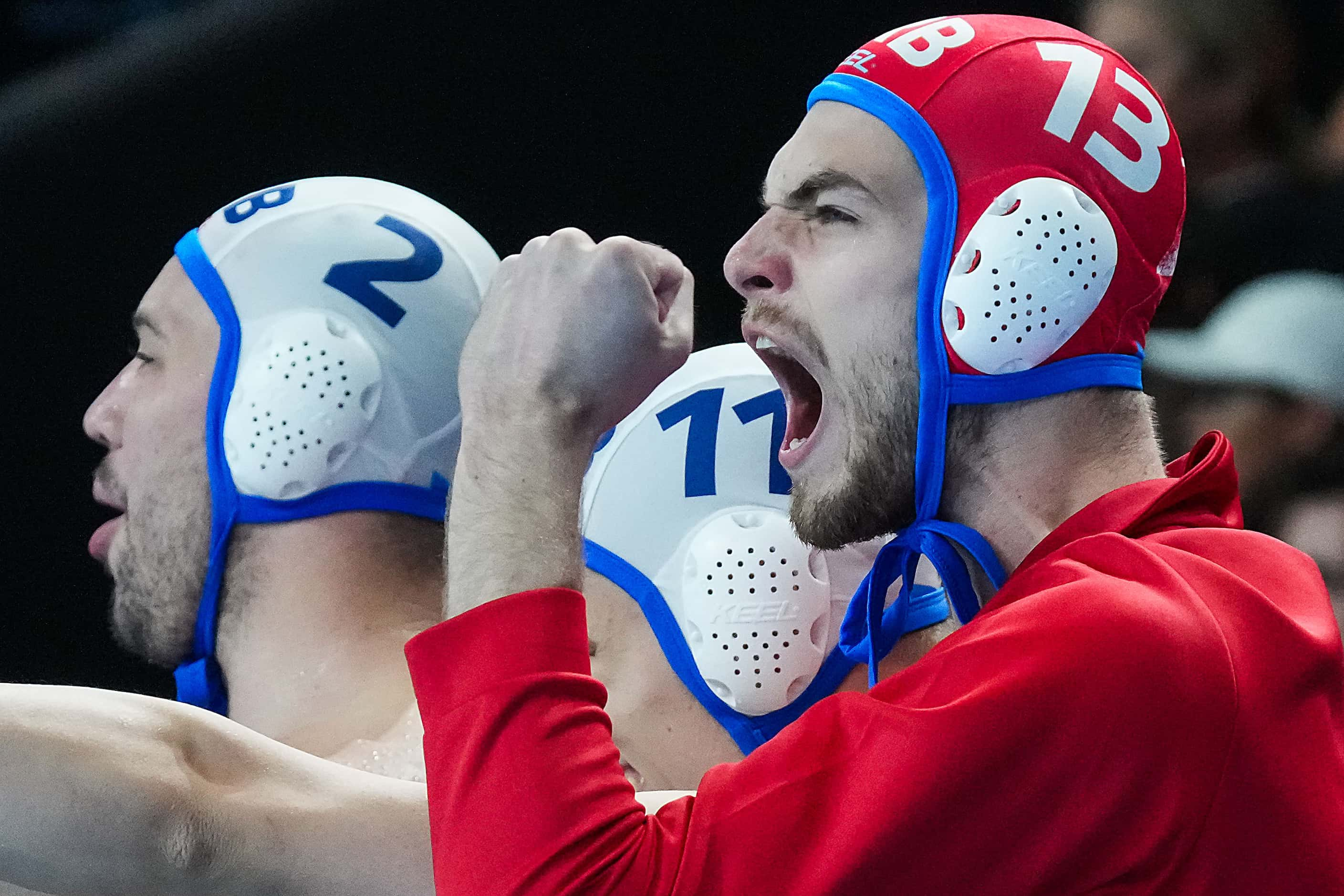 Vladimir Misovic (13) of Serbia celebrates with teammates after a victory over the United...