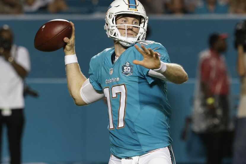 Miami Dolphins quarterback Ryan Tannehill (17) looks to pass during the first half of a...