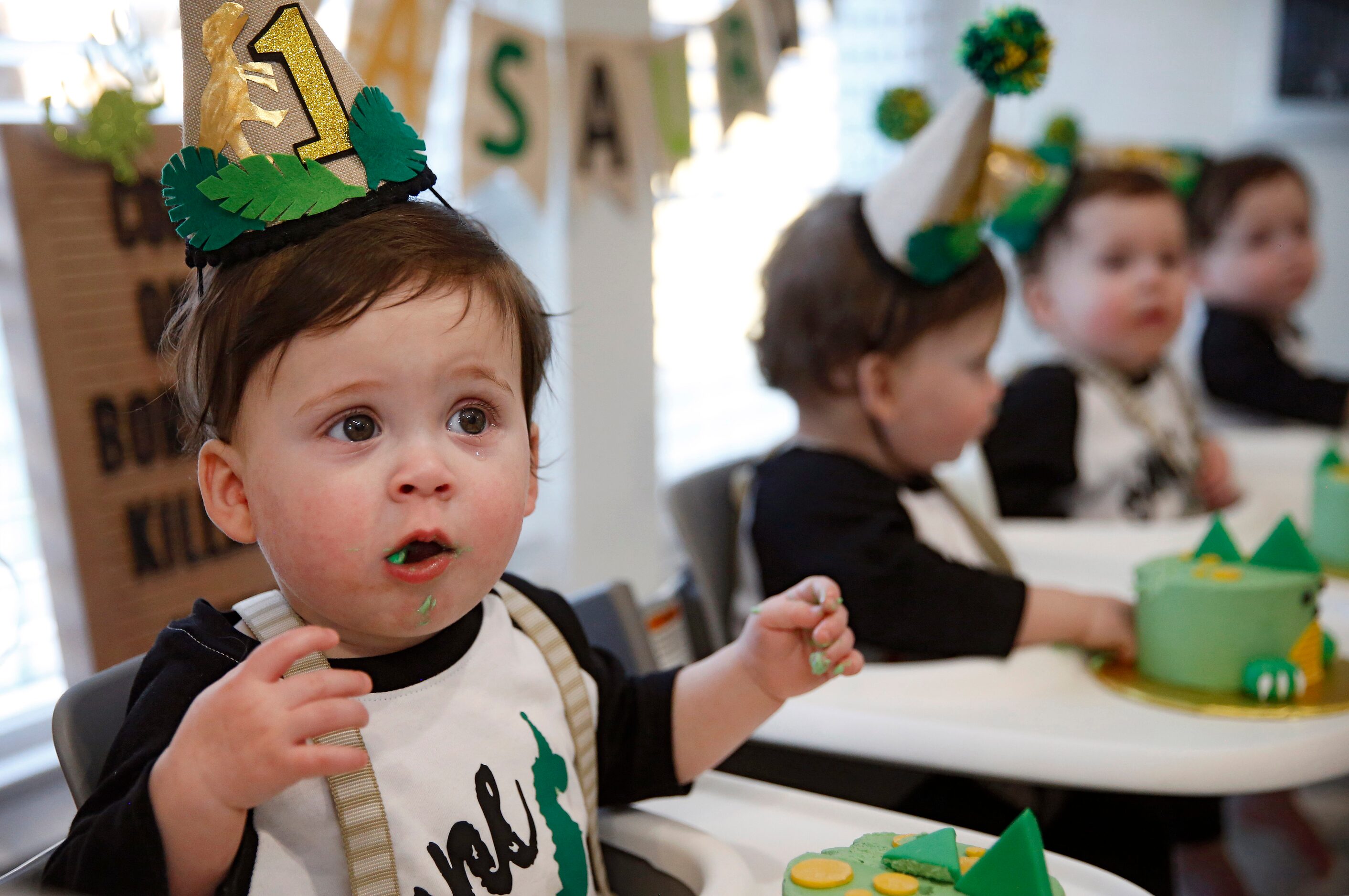 Harrison Marr reacts as he tastes icing on the cake along with his brothers Hardy, Henry,...