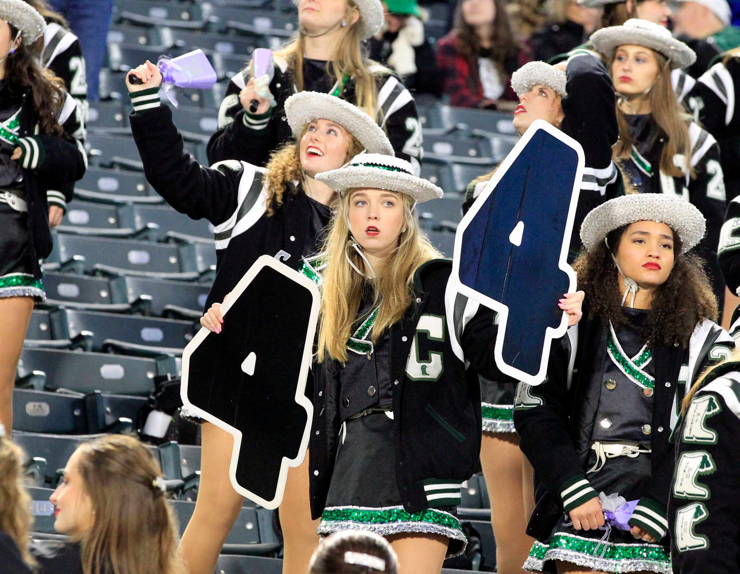 The Southlake drill teams celebrates in the stands, as the team pulls ahead during the Class...