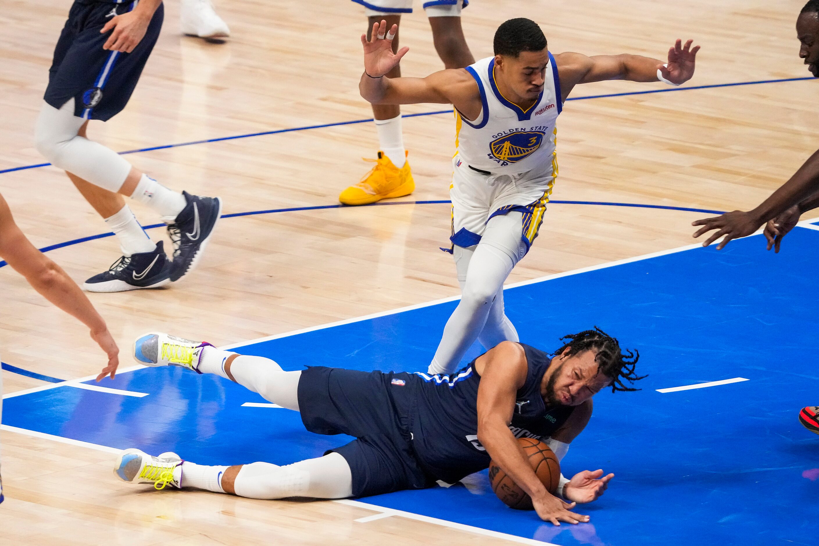 Dallas Mavericks guard Jalen Brunson (13) slips to the floor as Golden State Warriors guard...