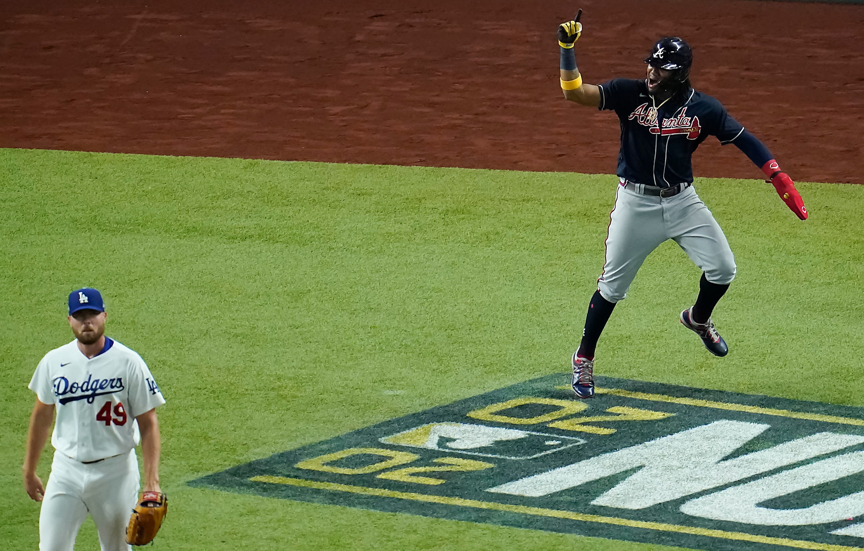 Atlanta Braves center fielder Ronald Acuna Jr. celebrates after scoring on a single by...