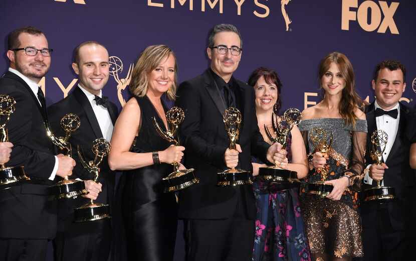 British comedian and television host John Oliver and his crew poses with the Emmy for...