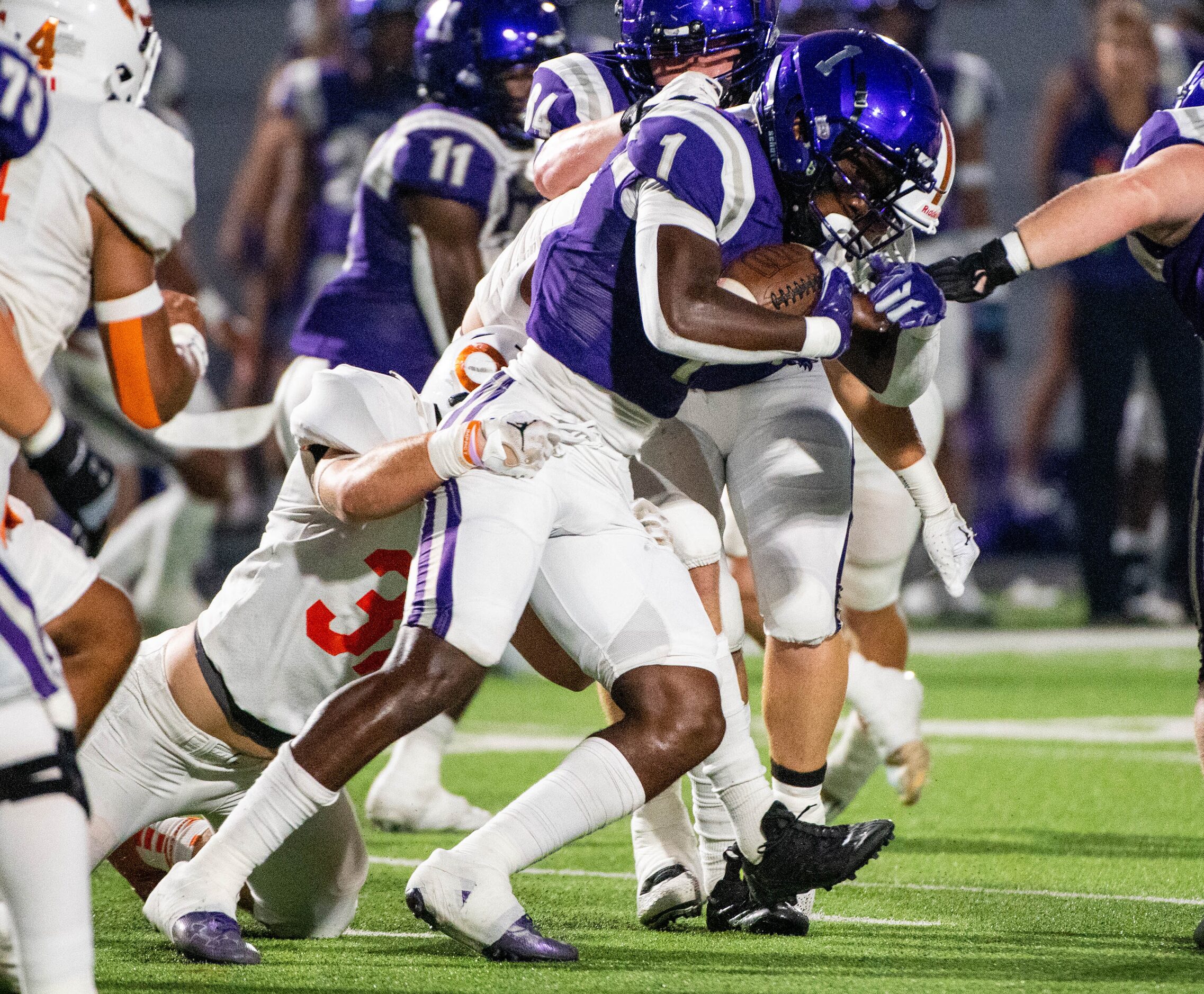 Anna running back Jambres Dubar (1) runs through a tackle attempt by Celina’s Grayson...