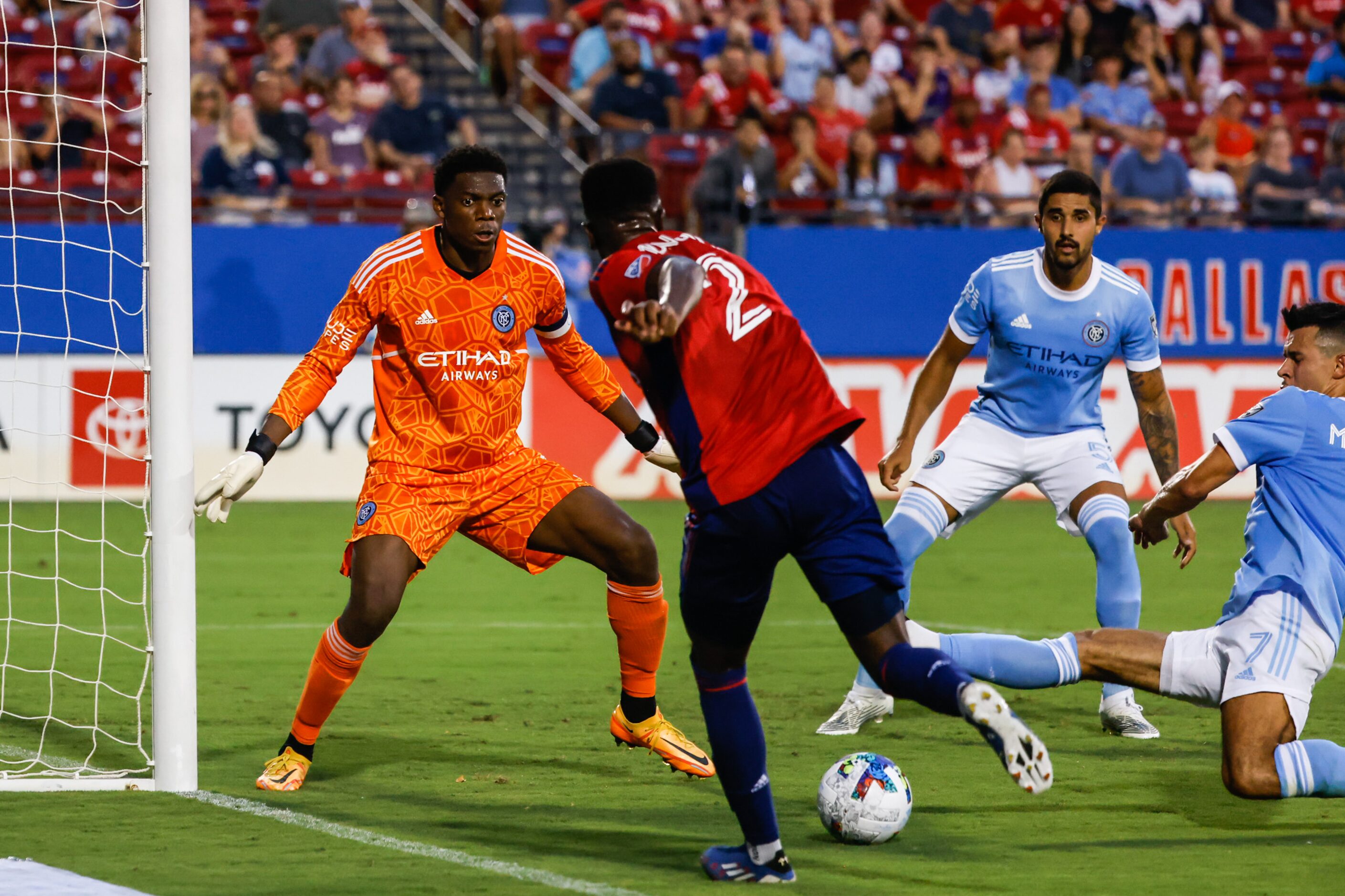 FC Dallas defender Eddie Munjoma (2) tries to score a goal against the New York City during...