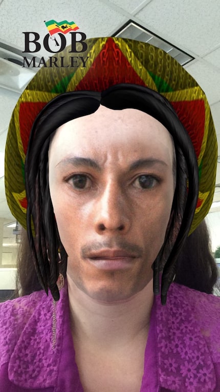 The Snapchat filter gives everyone a 5 o'clock shadow, dreadlocks and black skin.