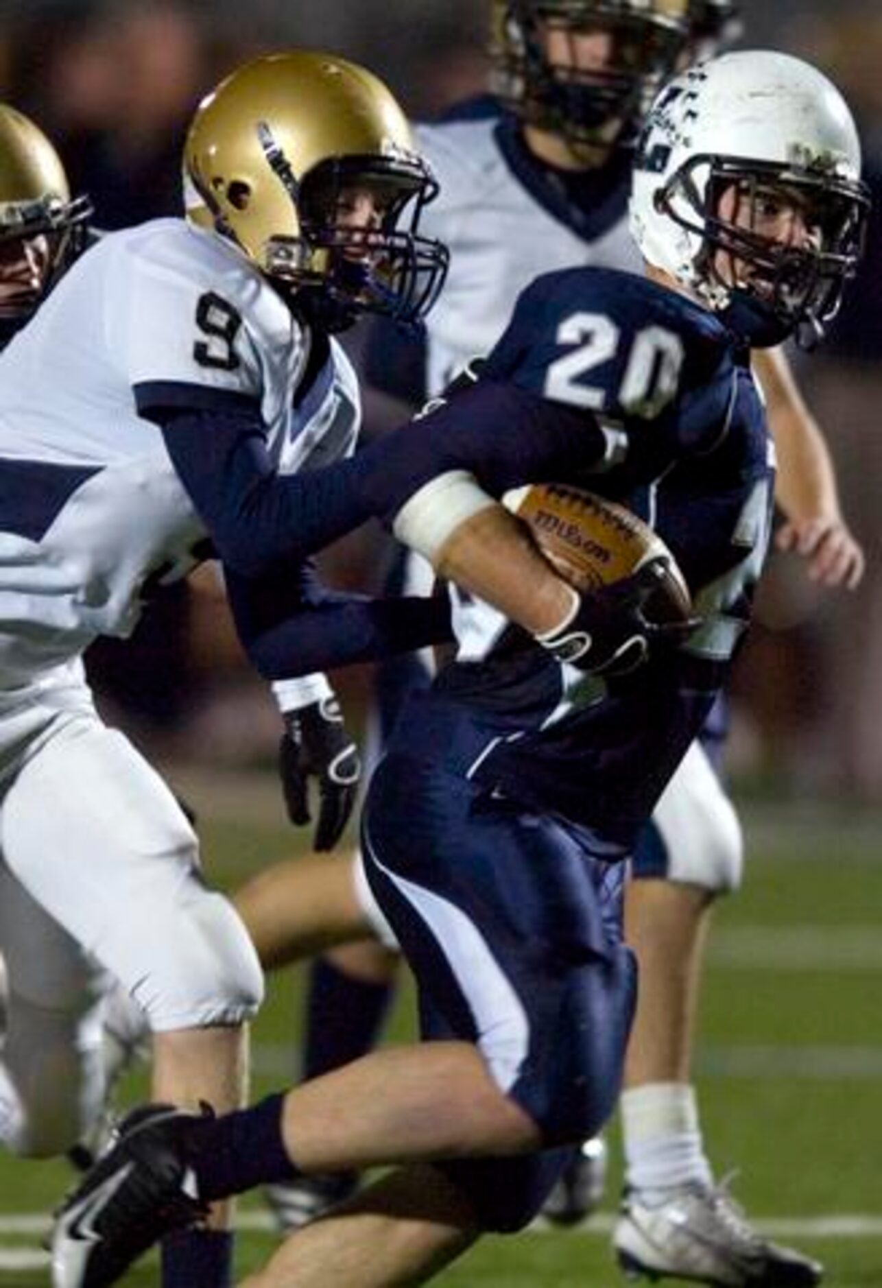 Argyle Liberty Christian junior running back Justin Stephens (20) is tackled by Arlington...