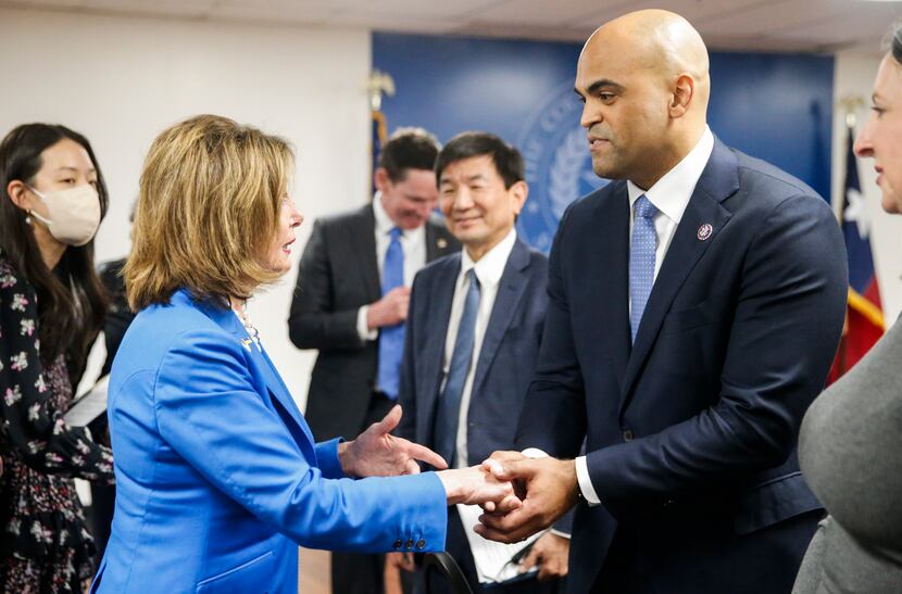 House Speaker Nancy Pelosi of Calif., shakes hand with  Rep. Colin Allred, D-Texas, right,...