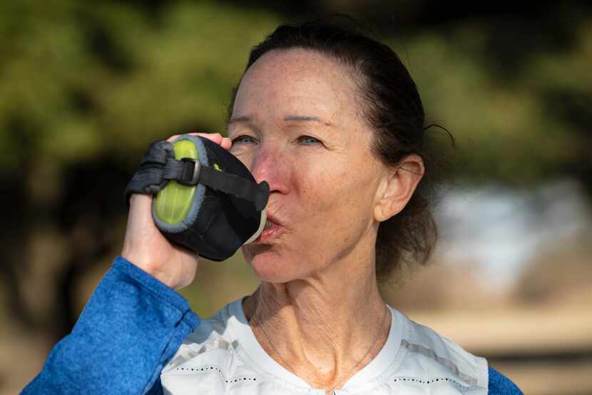 Maggie Riba, 62, takes water with her on her daily runs. The running coach and personal...