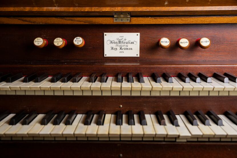 The organ's nameplate includes its original builder, John W. Gratian, and its 1975 restorer,...