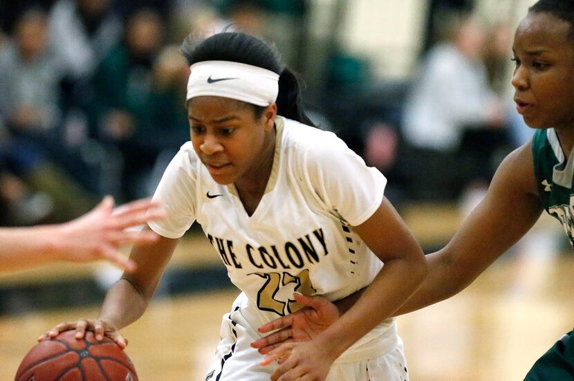 The Colony forward Jewel Spear (23) is defended by Prosper post Jordyn Oliver (3) during the...