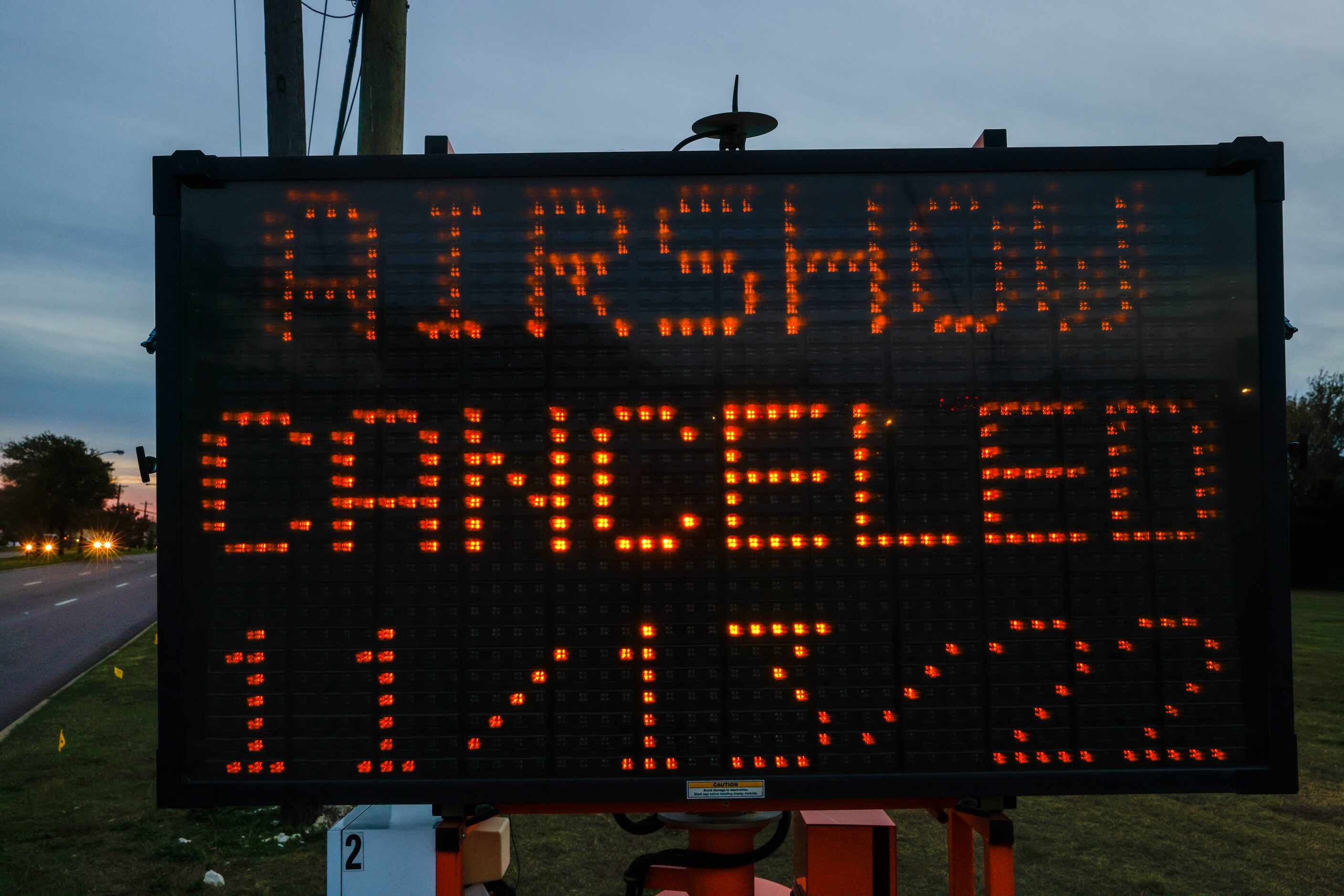 A sign outside of the entrance to the Dallas Executive Airport along Hampton Road flashes...