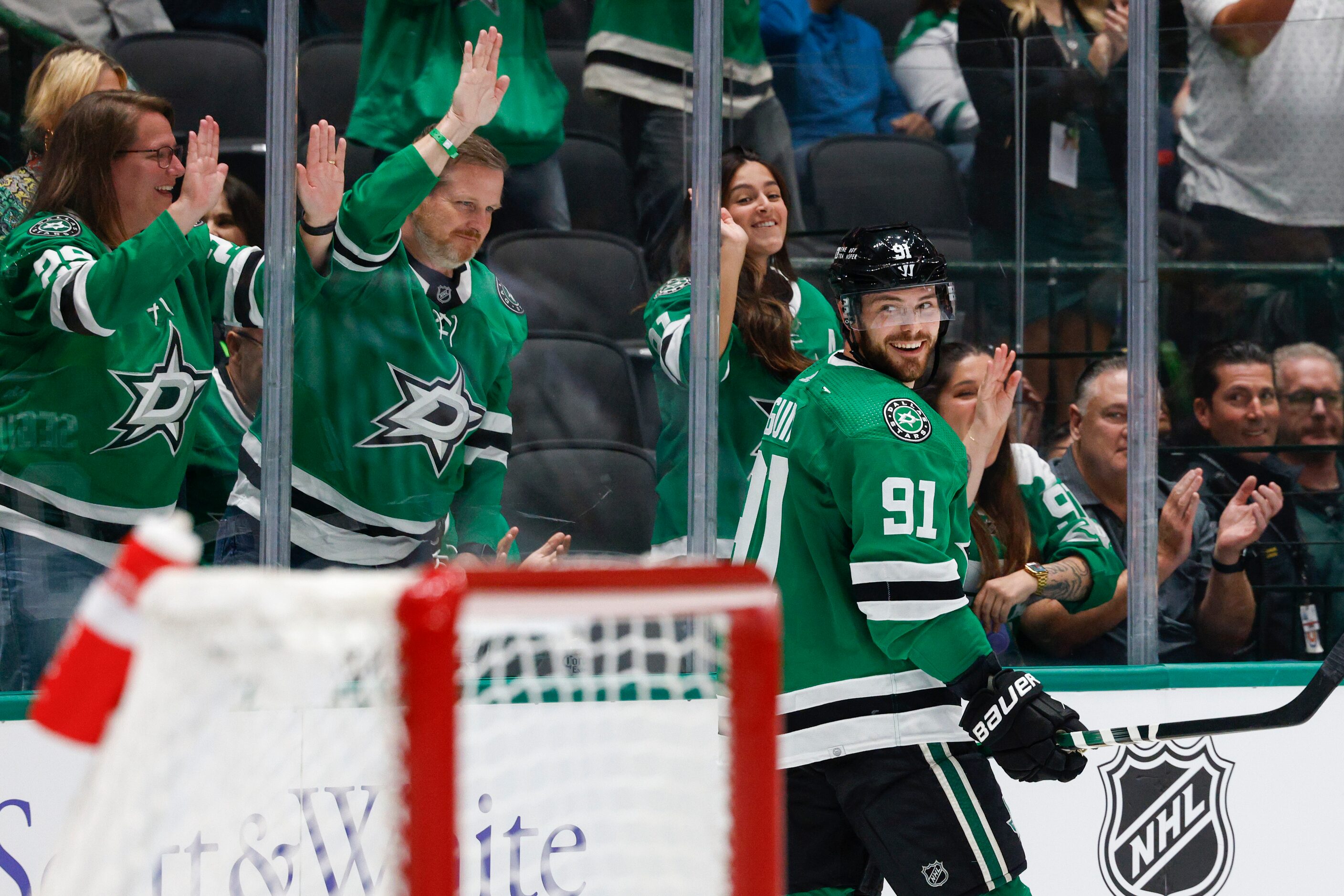 Dallas Stars center Tyler Seguin (91) smiles after scoring a goal during the third period of...