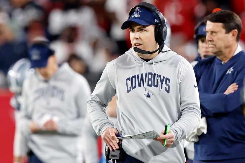 Dallas Cowboys offensive coordinator Kellen Moore paces the sideline during the second half...