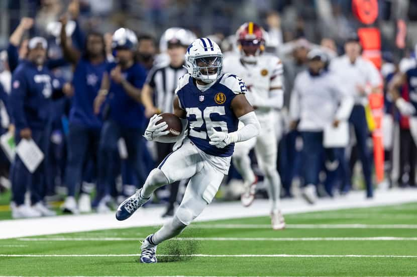 Dallas Cowboys cornerback DaRon Bland (26) runs back an interception for a touchdown during...