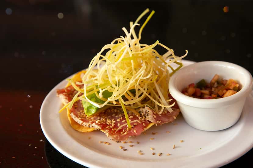 Caribbean's Shark Seafood features tuna with avocado, chipotle sauce on a tostada topped off...