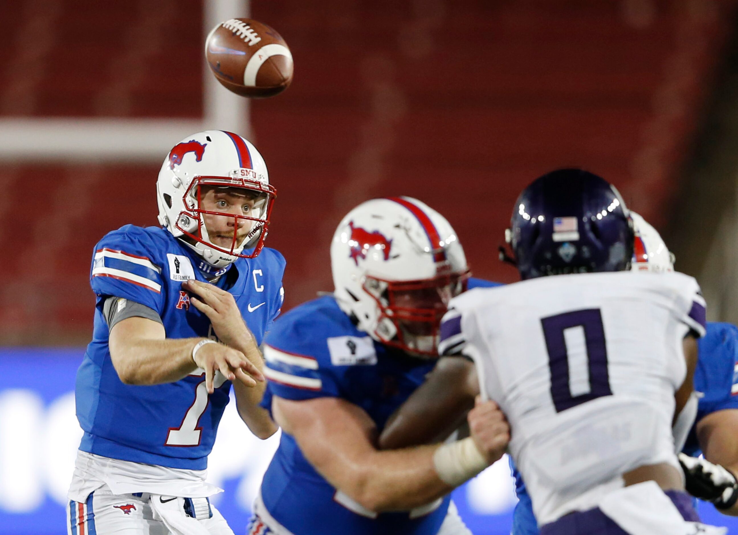 Southern Methodist Mustangs quarterback Shane Buechele (7) attempts a pass in a game against...