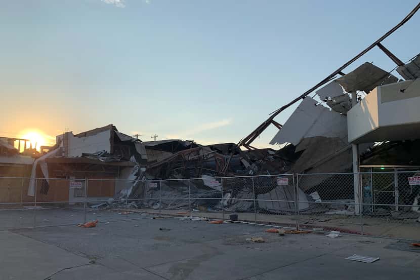 The sun sets on the ruins of the shopping plaza at Walnut Hill and Marsh lanes in Dallas in...
