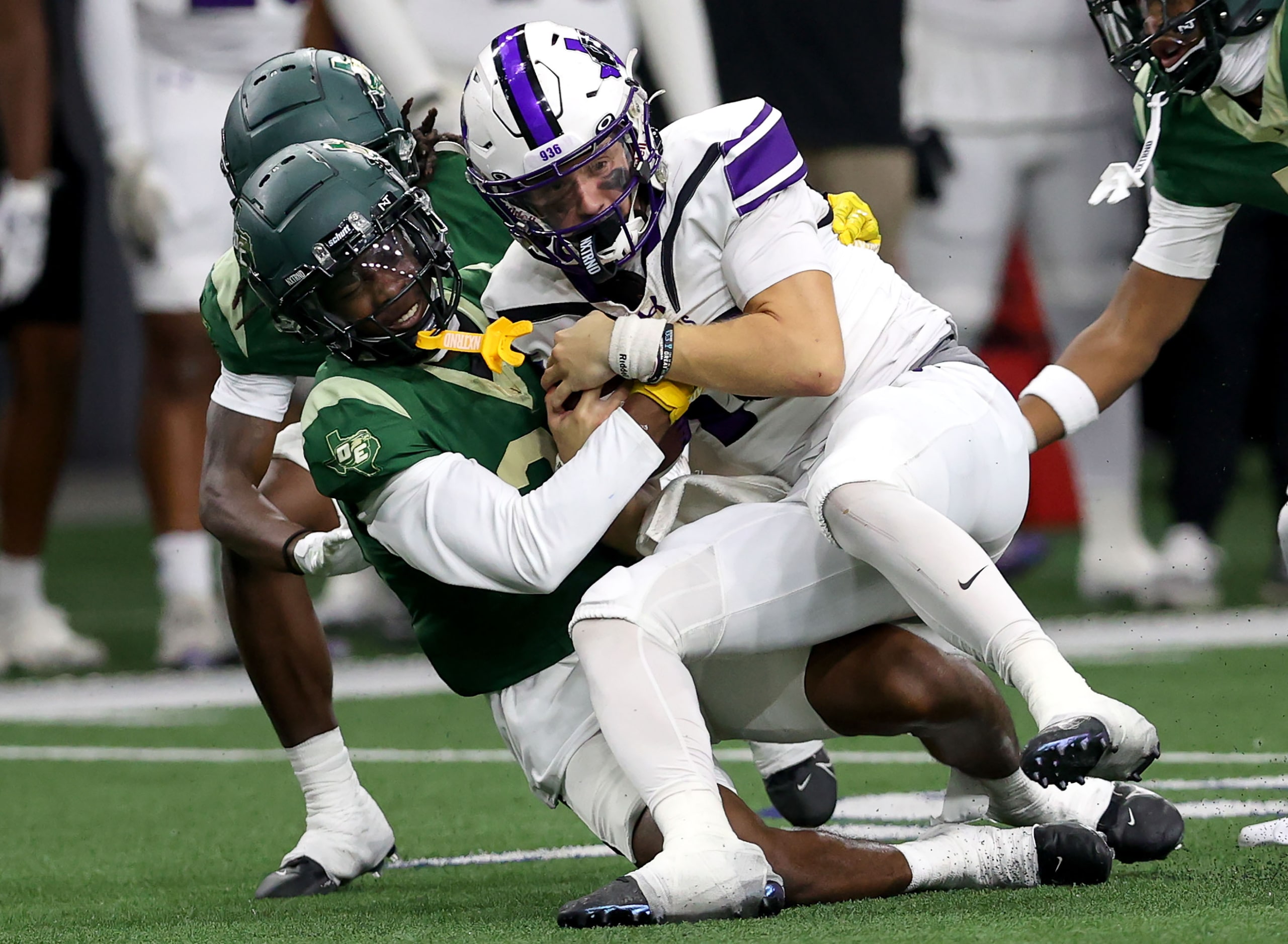 Willis quarterback Jack Emerson (right) is sacked by DeSoto defensive back Jordan Stevens...