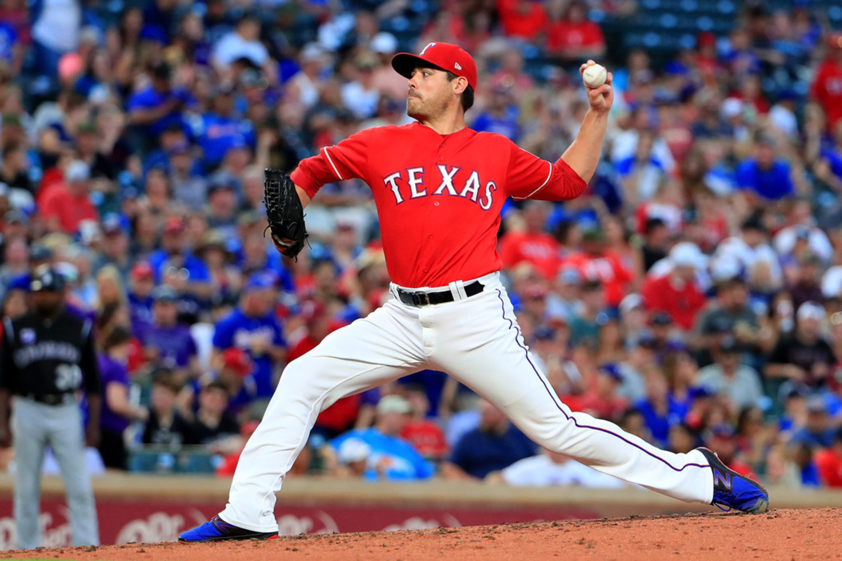 ARLINGTON, TX - JUNE 15:  Matt Moore #55 of the Texas Rangers pitches against the Colorado...